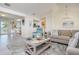Open-concept living room with a modern design, comfortable seating, and seamless flow to other living spaces at 118 Wall St, Redington Shores, FL 33708