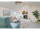 Inviting living room with a stone fireplace, recessed lighting, ceiling fan, and stylish decor at 118 Wall St, Redington Shores, FL 33708