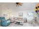 Cozy living area with a comfortable sectional sofa, stylish decor, and a large window offering natural light at 118 Wall St, Redington Shores, FL 33708