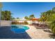 Sparkling swimming pool surrounded by a brick patio and lush landscaping for relaxing outdoors at 118 Wall St, Redington Shores, FL 33708