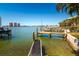 Deep water access from a private dock and lift with panoramic views of the bay at 118 Wall St, Redington Shores, FL 33708