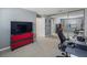 Bright bedroom with a desk, red shelving, and mirrored closet reflecting the bedroom's layout at 12 Ridgecroft Ln, Safety Harbor, FL 34695