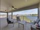 Relaxing outdoor balcony with comfortable seating and a tranquil lake view at 12808 Boggy Creek Dr, Riverview, FL 33579