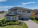 Two-story home with stone accents and a paver driveway under a bright blue sky at 12808 Boggy Creek Dr, Riverview, FL 33579