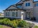 Beautiful home entrance with manicured landscaping, stone accents, and a paver walkway at 12808 Boggy Creek Dr, Riverview, FL 33579