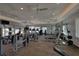 Bright community gym with an array of modern exercise equipment, ceiling fans, and natural light from windows at 12808 Boggy Creek Dr, Riverview, FL 33579