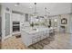 Bright, modern kitchen with island seating, stainless steel appliances, and ample storage at 12808 Boggy Creek Dr, Riverview, FL 33579