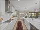 Bright, modern kitchen with white cabinets, subway tile backsplash, and a spacious center island at 12808 Boggy Creek Dr, Riverview, FL 33579