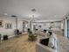 Open-concept living space with stylish furniture, modern lighting, and a bright, airy feel at 12808 Boggy Creek Dr, Riverview, FL 33579