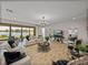 Bright living room with water view, contemporary decor, and sleek entertainment center at 12808 Boggy Creek Dr, Riverview, FL 33579