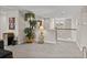 A spacious loft area with neutral tones, large windows, and stylish decor, creating a cozy atmosphere at 12808 Boggy Creek Dr, Riverview, FL 33579