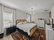 Serene main bedroom featuring a stylish bed, soft lighting, and elegant decor at 12808 Boggy Creek Dr, Riverview, FL 33579