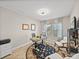 Bright office features a modern desk, stylish rug, natural light, and neutral paint at 12808 Boggy Creek Dr, Riverview, FL 33579