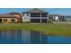 Home with a screened lanai and peaceful pond view, seamlessly blending indoor/outdoor living at 12808 Boggy Creek Dr, Riverview, FL 33579