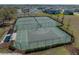 Aerial view of community sport courts featuring basketball, tennis and pickleball, surrounded by a secure fence at 12808 Boggy Creek Dr, Riverview, FL 33579
