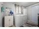 Laundry room features a washer, dryer, sink, and storage space at 133 15Th Nw St, Largo, FL 33770