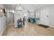 Spacious living room area boasts modern decor, light flooring, and an entryway at 133 15Th Nw St, Largo, FL 33770