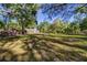 Expansive backyard with mature trees, providing ample space and natural beauty at 14114 N 301 Hwy, Thonotosassa, FL 33592