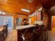 The kitchen includes stainless appliances, wood cabinets, a breakfast bar, and wood ceilings at 14114 N 301 Hwy, Thonotosassa, FL 33592