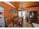 Kitchen featuring a stainless steel refrigerator, wood table, and seating at 14114 N 301 Hwy, Thonotosassa, FL 33592