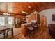 Open kitchen with stainless steel appliances, breakfast bar, and wood-paneled ceiling at 14114 N 301 Hwy, Thonotosassa, FL 33592