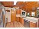 Kitchen with stainless steel appliances, light countertops, and wood floors at 14114 N 301 Hwy, Thonotosassa, FL 33592