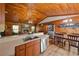 Kitchen with stainless appliances, bar seating, and hardwood floors at 14114 N 301 Hwy, Thonotosassa, FL 33592