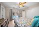 Bedroom featuring a ceiling fan, a ceiling fan, natural light, and a view of the pool at 1542 Picardy Cir, Clearwater, FL 33755