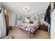 Cozy bedroom with tiled floors and comfortable-looking bed with a floral comforter at 1542 Picardy Cir, Clearwater, FL 33755
