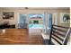 Bright dining area with sliding glass doors offering a serene pool view at 1542 Picardy Cir, Clearwater, FL 33755