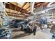 Spacious garage with open rafter ceiling, ample storage, and parking for two vehicles at 1542 Picardy Cir, Clearwater, FL 33755