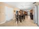 Open dining area with tile floors leading into the kitchen at 1542 Picardy Cir, Clearwater, FL 33755