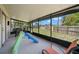 Enclosed patio area perfect for outdoor entertaining and relaxation with lawn views at 1542 Picardy Cir, Clearwater, FL 33755