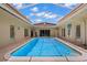 Sparkling pool with a screened enclosure, ideal for year-round enjoyment at 1542 Picardy Cir, Clearwater, FL 33755