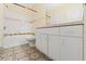 Well-lit bathroom featuring a tub with shower, patterned floor tiles and vanity with white cabinets at 17108 Carrington Park Dr # 711, Tampa, FL 33647