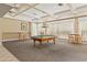 Elegant billiards room with a classic pool table, creating a sophisticated space for leisure and entertainment at 17108 Carrington Park Dr # 711, Tampa, FL 33647