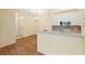 The open concept kitchen and dining area offers seamless flow and hardwood flooring for easy living at 17108 Carrington Park Dr # 711, Tampa, FL 33647