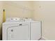 This laundry room has a white Maytag washer and dryer at 17108 Carrington Park Dr # 711, Tampa, FL 33647