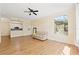 Spacious living room featuring hardwood floors, modern kitchen view, and large windows with natural light at 17108 Carrington Park Dr # 711, Tampa, FL 33647