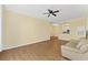 Inviting living room with hardwood floors and a ceiling fan provides a comfortable and stylish space at 17108 Carrington Park Dr # 711, Tampa, FL 33647
