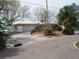 Charming single-story home with a two-car garage and well-maintained landscaping at 1844 Venetian Point Dr, Clearwater, FL 33755