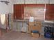 Living area with tiled floors, brown window blinds, and interior repair work in progress at 1844 Venetian Point Dr, Clearwater, FL 33755