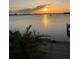 Spectacular sunset over the water, reflecting sunlight off the gentle waves at 1844 Venetian Point Dr, Clearwater, FL 33755