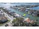 Aerial view of waterfront homes on a canal with easy access to the bay and nearby islands and mainland at 2829 Seabreeze S Dr, Gulfport, FL 33707