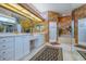 A spacious bathroom with dual sinks, tub, walk-in shower, and ample counter space at 2829 Seabreeze S Dr, Gulfport, FL 33707