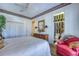 Bedroom showcasing en-suite bathroom, spacious closet, and comfortable seating at 2829 Seabreeze S Dr, Gulfport, FL 33707