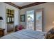 A bedroom with waterfront views has access to the outdoors and an ensuite bathroom at 2829 Seabreeze S Dr, Gulfport, FL 33707