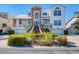 Stunning two-story waterfront home featuring lush landscaping, a grand entrance staircase, and attached garage at 2829 Seabreeze S Dr, Gulfport, FL 33707