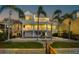Back exterior view with a pool and covered patios, perfect for relaxation and entertainment at 2829 Seabreeze S Dr, Gulfport, FL 33707