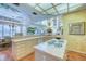Bright kitchen with an island cooktop, eating area, and seamless access to a spacious living area at 2829 Seabreeze S Dr, Gulfport, FL 33707